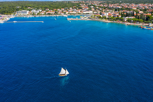 Classic wooden sail boat sailing near Malinska, Croatia, aerial view