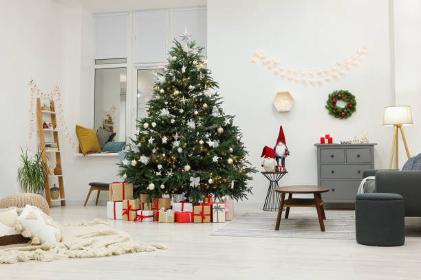 istock Beautiful Christmas tree and gift boxes in living room. Interior design 1786598976