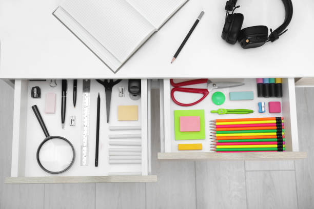 istock Office supplies in open desk drawers, top view 1786619504