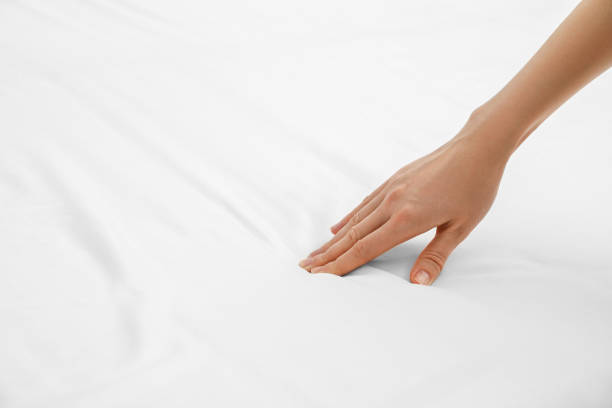 istock Woman touching orthopedic mattress, closeup. Space for text 1786619515