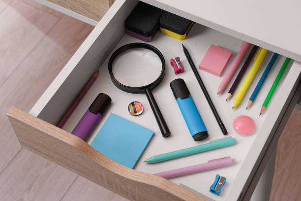 istock Office supplies in open desk drawer, above view 1786619519
