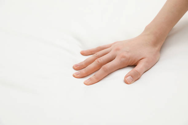 istock Woman touching orthopedic mattress, closeup. Space for text 1786620038
