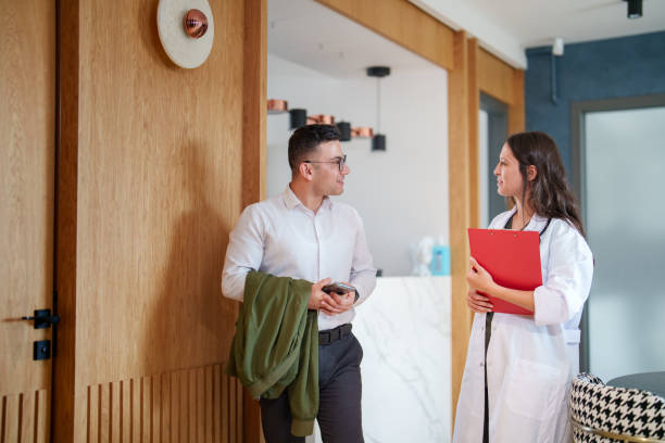 istock The female doctor is seeing off her patient. 1786627332