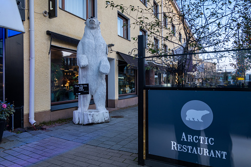 Rovaniemi, Finland Oct 10, 2023 The facade and entrance to a local restaurant downtown called the Arctic Restaurant, and a polar bear figure.