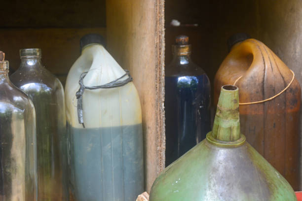 Old siphons for soda water. Home accessories from the last century set on the windowsill. Season of the autumn.