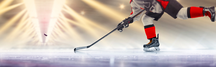 Hockey player in action close-up. Hockey player in beautiful ice rink. Hockey concept. Hockey training. Ice. Sport