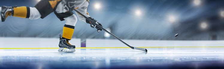 Hockey player in action close-up. Hockey player in ice rink. Hockey concept. Ice. Hockey training. Sport