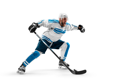 Sports emotions. Hockey concept. Athlete in action. Professional hockey player playing hockey on a white background. Sport