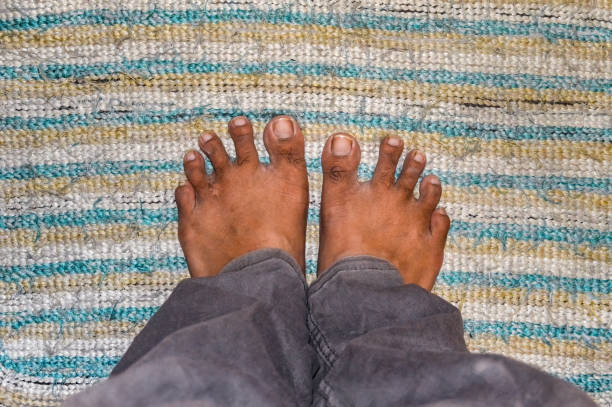 istock a man's foot stepping on the doormat 1786861787