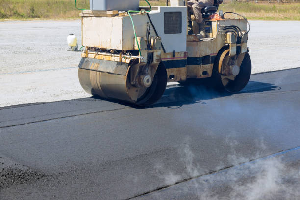 istock Worker uses asphalt roller is laying asphalt to road 1786930082