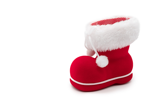 Little Red boot of Santa Claus with a white fur isolated on white background. Christmas season.