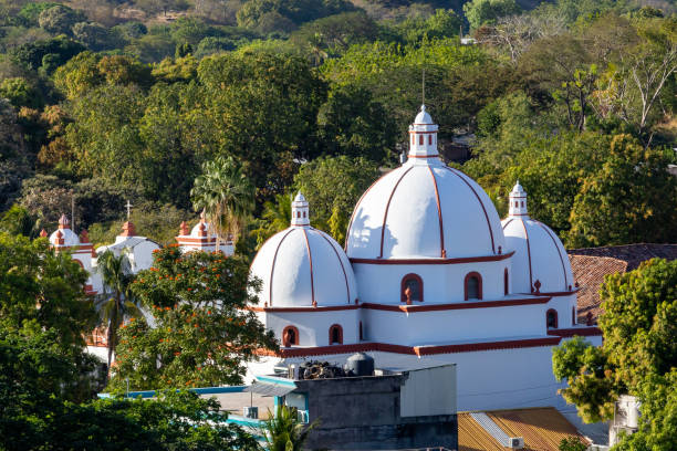istock Sunset light giving tridimensional aspect to a church thas has three domes, the second oldest in Latin America 1786953921