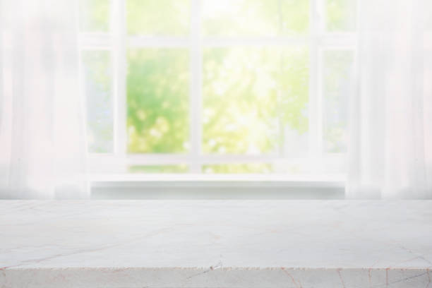 istock Selective focus.Elegance product display background with marble top with curtain and vine leaf on window garden in morning 1786992347