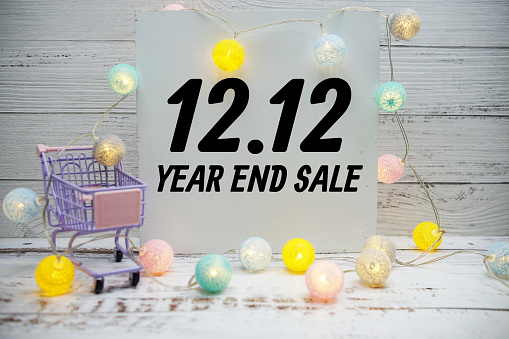 12.12 Year end sale text message with trolley shopping cart and LED cotton balls decoration