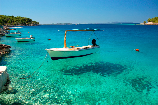 Picturesque scene of boats in a quiet bay of Milna on Brac island in Croatia