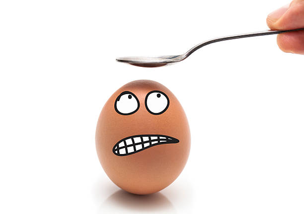 egg head with scared expression stock photo