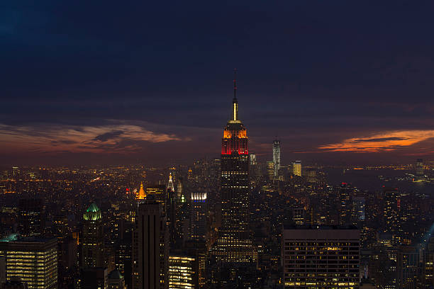 istock Illuminated Empire State and New York's skyline at dusk 178703237