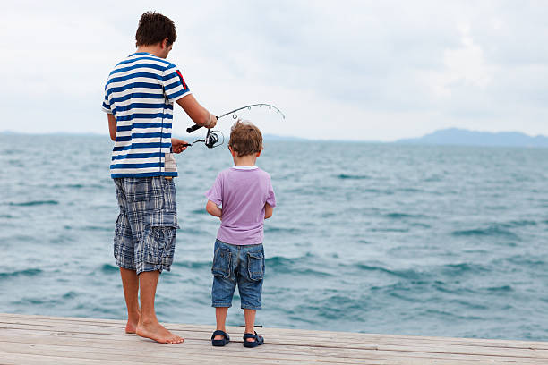 istock Father and son fishing 178703719