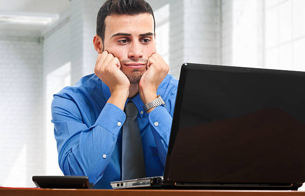 istock Tired businessman working at his laptop 178704738