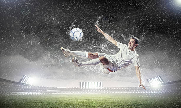 istock football player striking the ball 178704901
