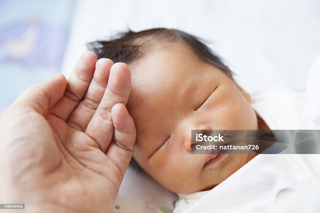 Baby sleeping Baby sleeping on a colorful cloth. 0-1 Months Stock Photo