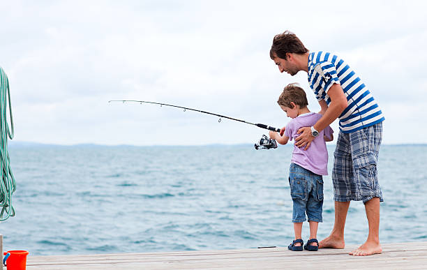 istock Father and son fishing together 178704994
