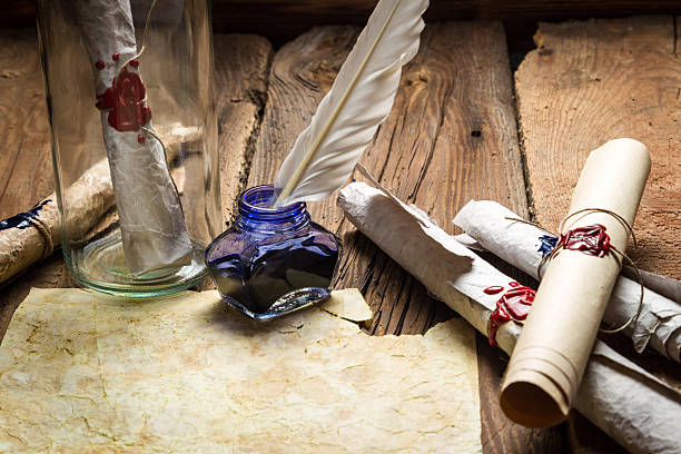 istock Writing ancient feather letter and send it in a bottle 178705586