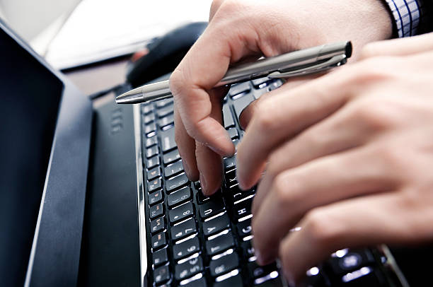 istock Businessman hands on a laptop keyboard 178705768