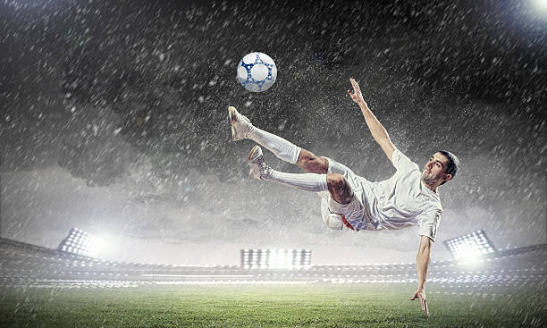 istock football player striking the ball 178706540