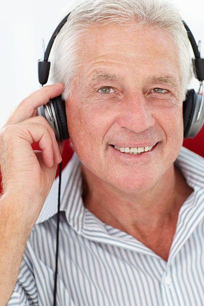 istock Senior man with headphones 178707005