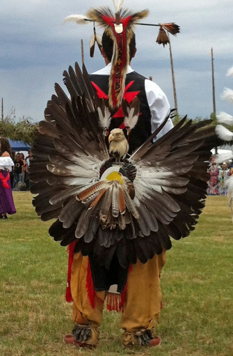 A native American dancer stands ready at a Taos Pow Wow, New Mexico, USA.