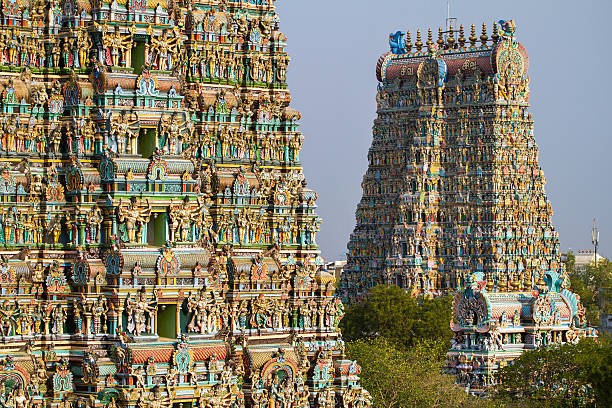 Meenakshi temple in Madurai MADURAI, INDIA - MARCH 3: Meenakshi temple - one of the biggest and oldest Indian temples on March 3, 2013 in Madurai, Tamil Nadu, India. The 14 gateway towers called gopura ranging from 45 to 50m. tamil temple stock pictures, royalty-free photos & images