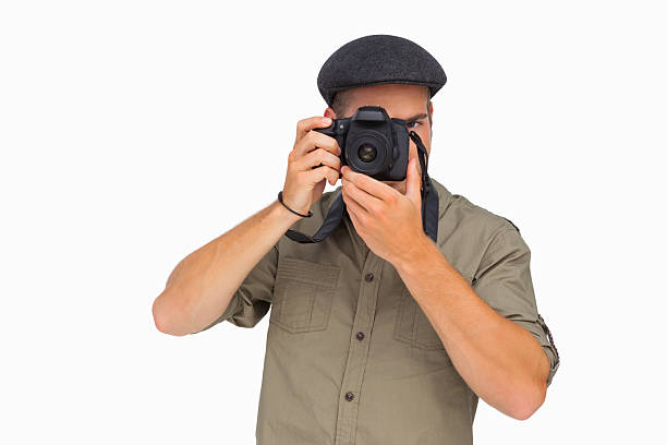 istock Man in peaked cap taking photo 178708277