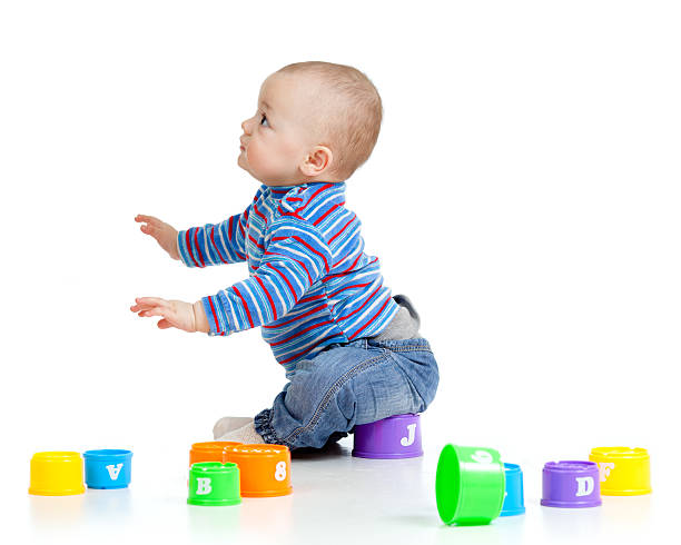 istock baby playing with cup toys 178708634