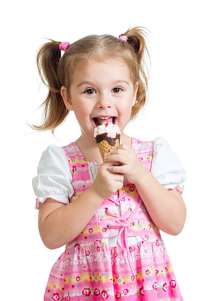 istock happy child girl eating ice cream in studio 178708914