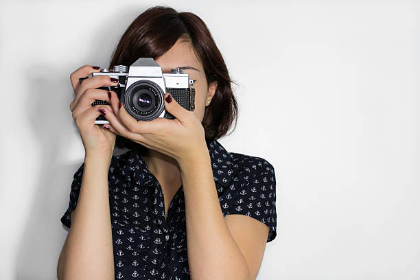 istock Young girl with a vintage camera 178708920