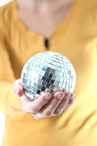 istock girl with mirror ball in her hand 178708994