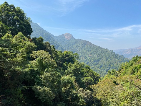 Green forests and mountains of the Western Ghats around Subrahmanya Road in Karnataka in South India.