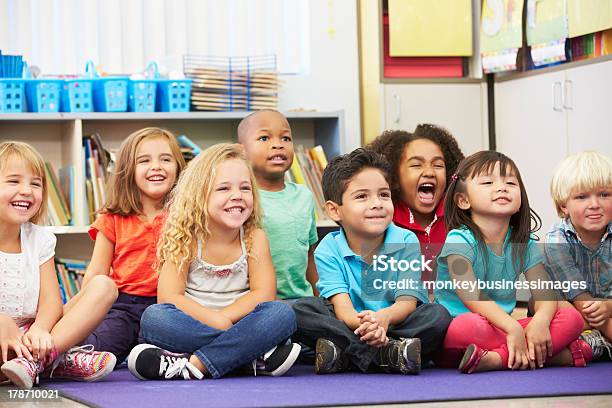 Group Of Elementary Pupils In Classroom Stock Photo - Download Image Now - Classroom, Happiness, Elementary Age