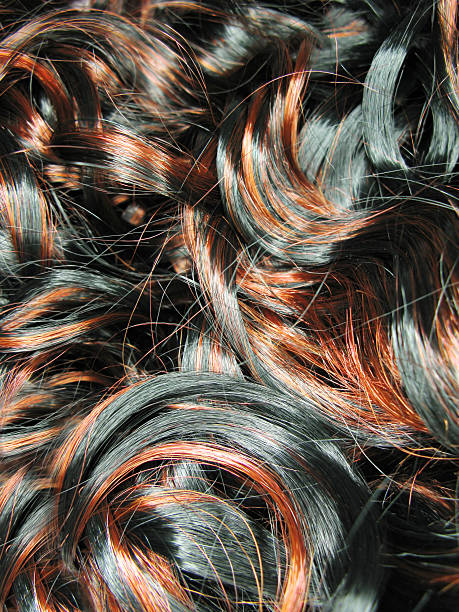 istock dark curly highlight hair texture background 178710916