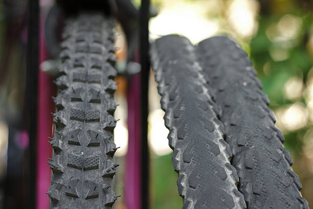 Close-up of bicycle tyre in neon lighting
