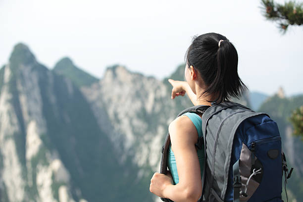 istock asian woman hiker mountain top 178711287