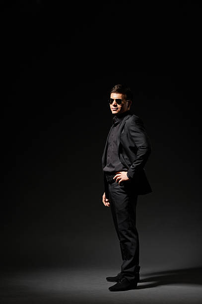 istock stylish young man in black suit 178711508
