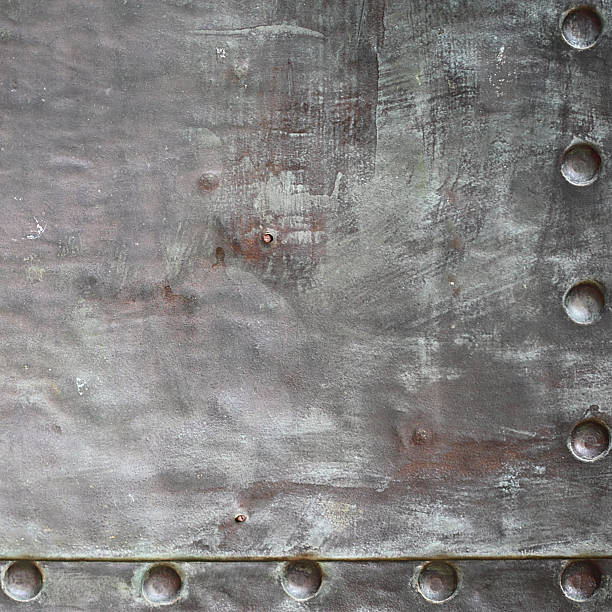 istock Black metal plate or armour texture with rivets 178711647