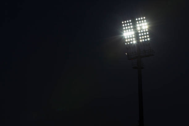 istock Stadium lights against dark night sky background 178711812