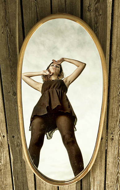 istock thoughtful woman with her reflection in mirror 178711971