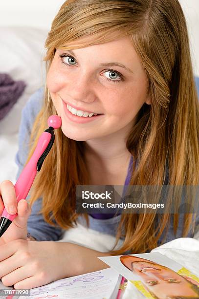 Smiling Teenage Girl Daydreaming Over Her Diary Stock Photo - Download Image Now - Adolescence, Adult, Bed - Furniture