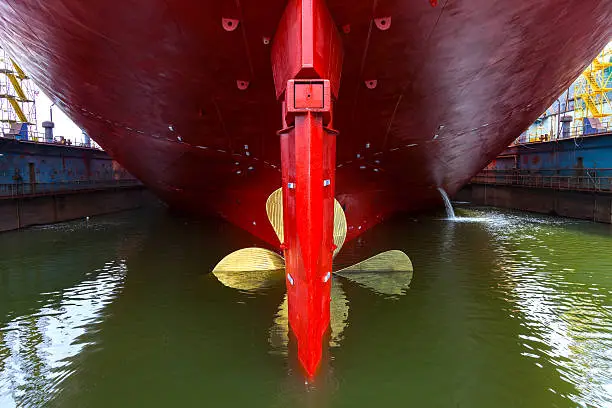Close up of a Ship Propeller in water.