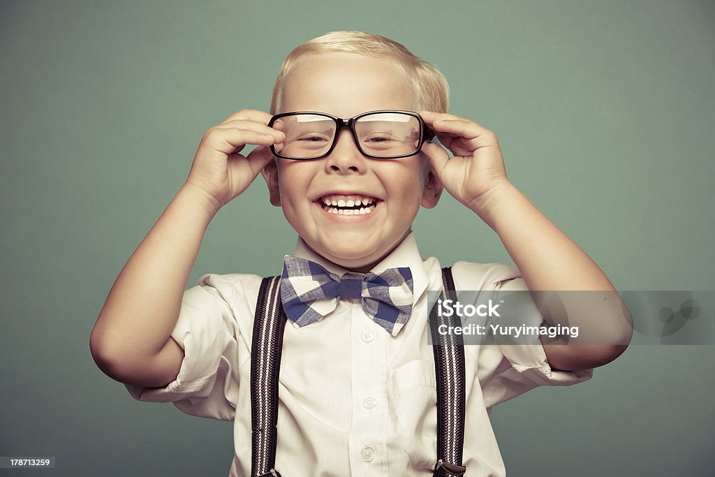 Children portrait Cheerful smiling funny boy on a green background. Back to School Stock Photo