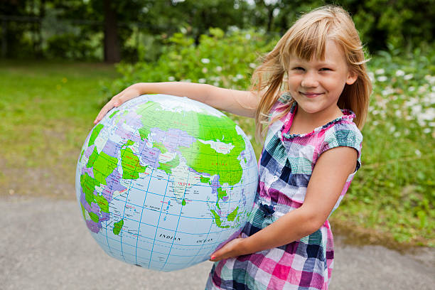 istock Girl holding an earth globe 178713323